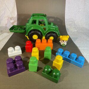Mega Brands, John Deere Mega Block Tractor with Figure. And 10 blocks (1345)